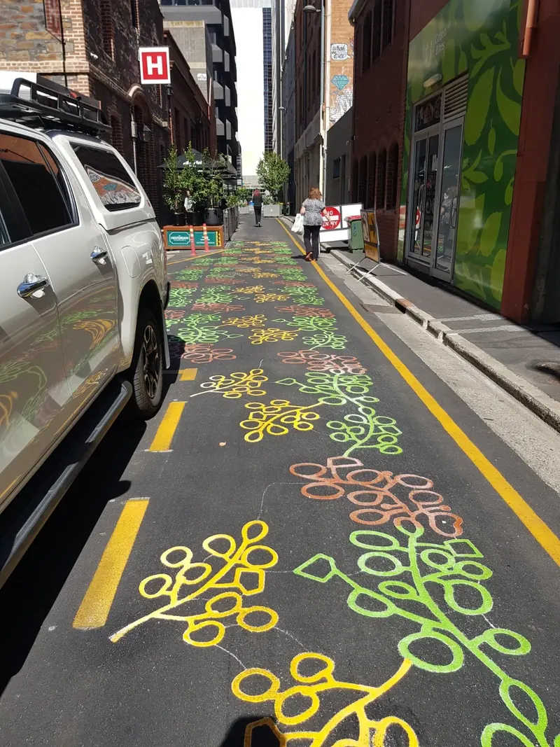 Decorative DuraTherm foliage pattern along a busy city street
