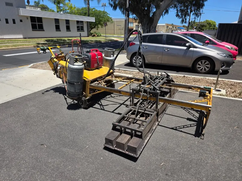 Infrared asphalt heating rig set up on a suburban street
