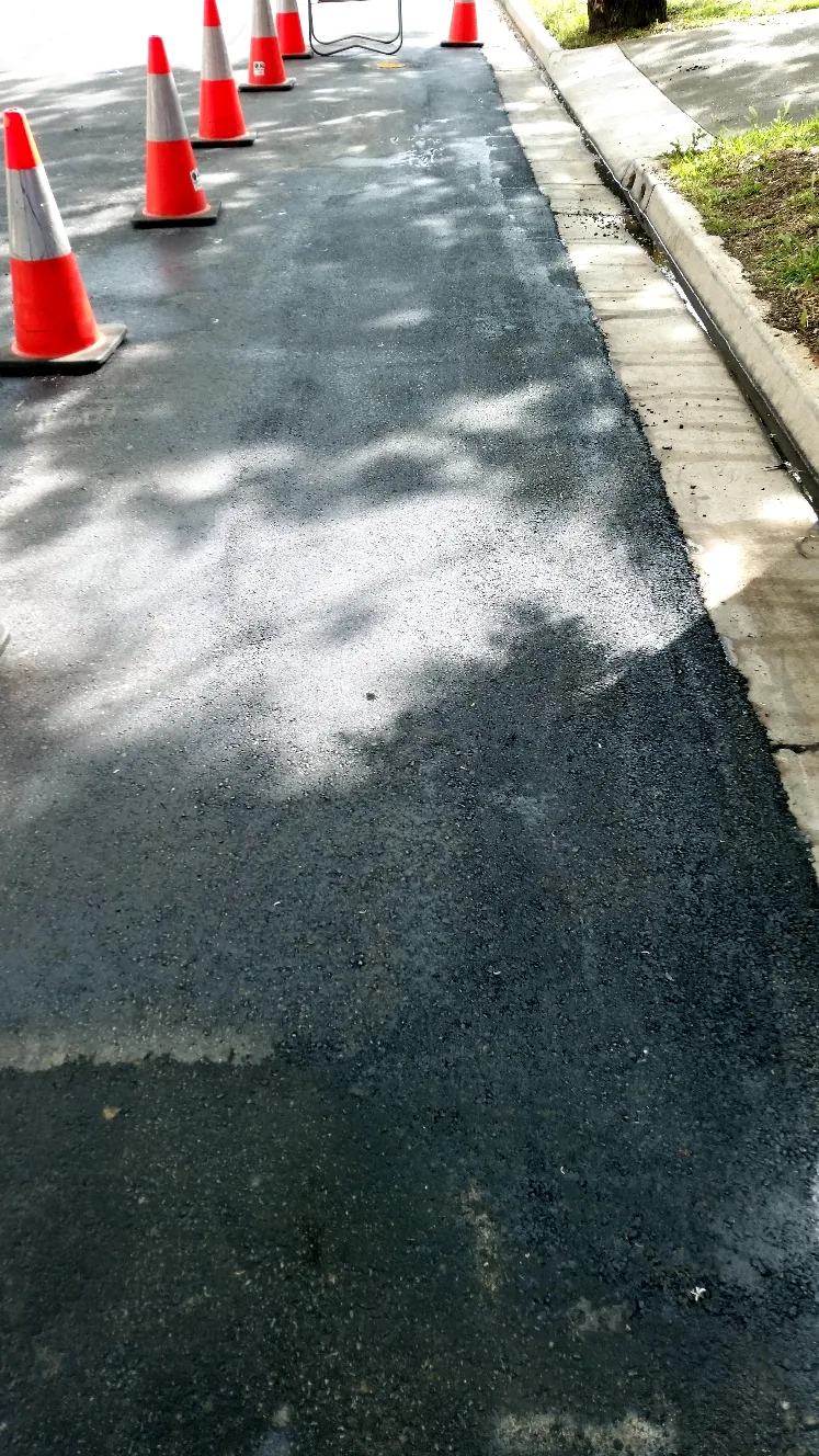 Completed infrared patch repair along a footpath edge