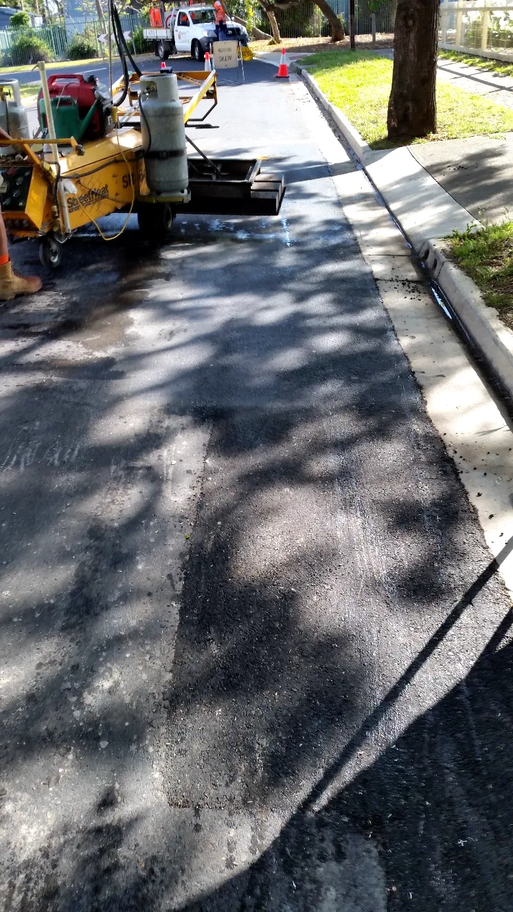 Seamless join on an infrared asphalt repair beside the kerb