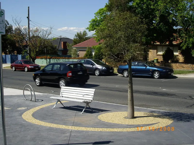 Gold RockPave permeable surfacing around a street bench