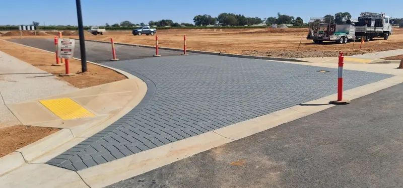 Charcoal paver pattern StreetPrint at a new estate intersection