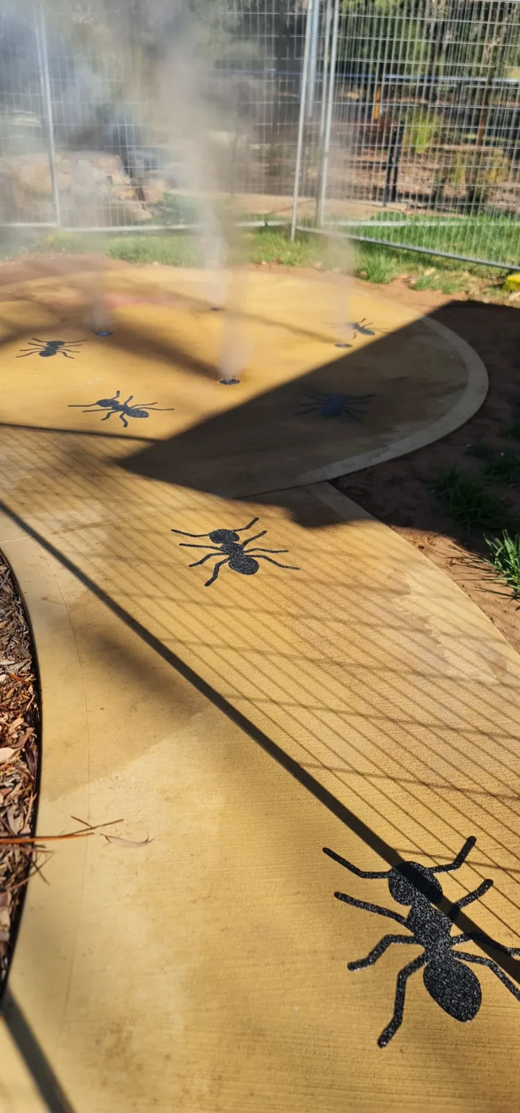 Ant stencils marching across a gold sealed path
